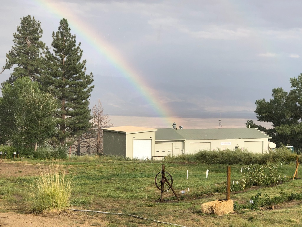 Outside view of the Fire House with a rainbow. 
